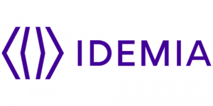 The image shows the IDEMIA logo with a stylized purple geometric symbol on the left and the word "IDEMIA" in bold purple letters on the right.